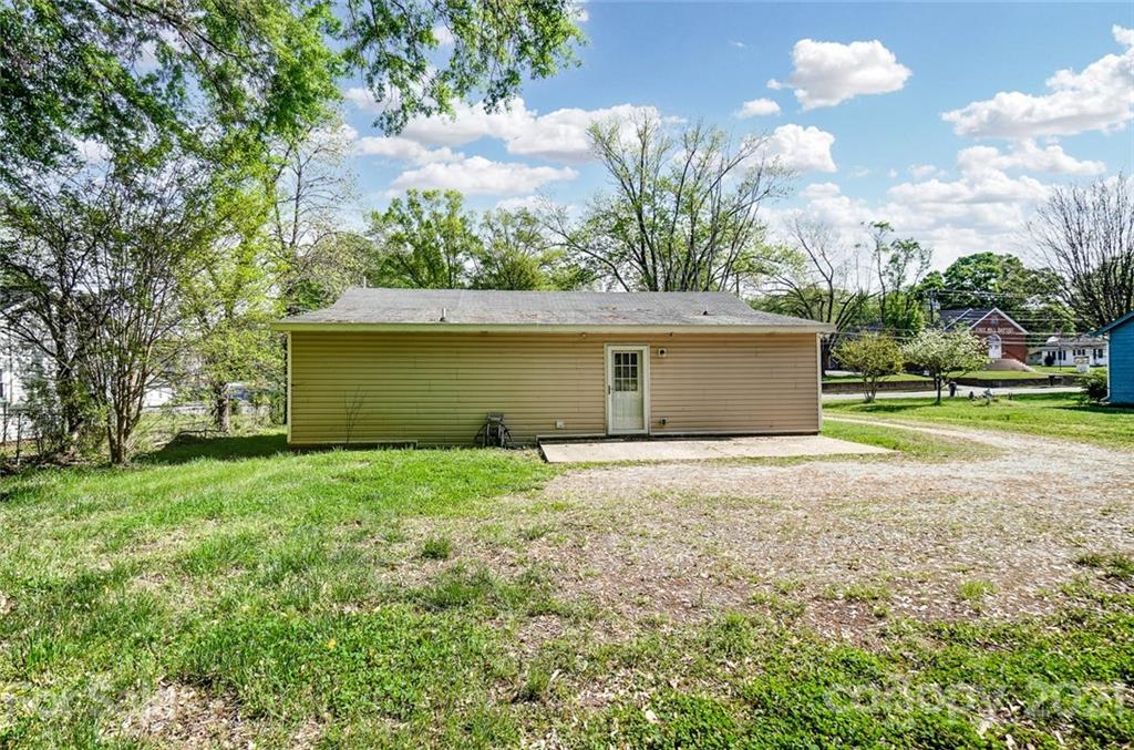 3003 Lowell Road Gastonia, NC 28054 - Photo 24 of 27 a view of a backyard with large trees