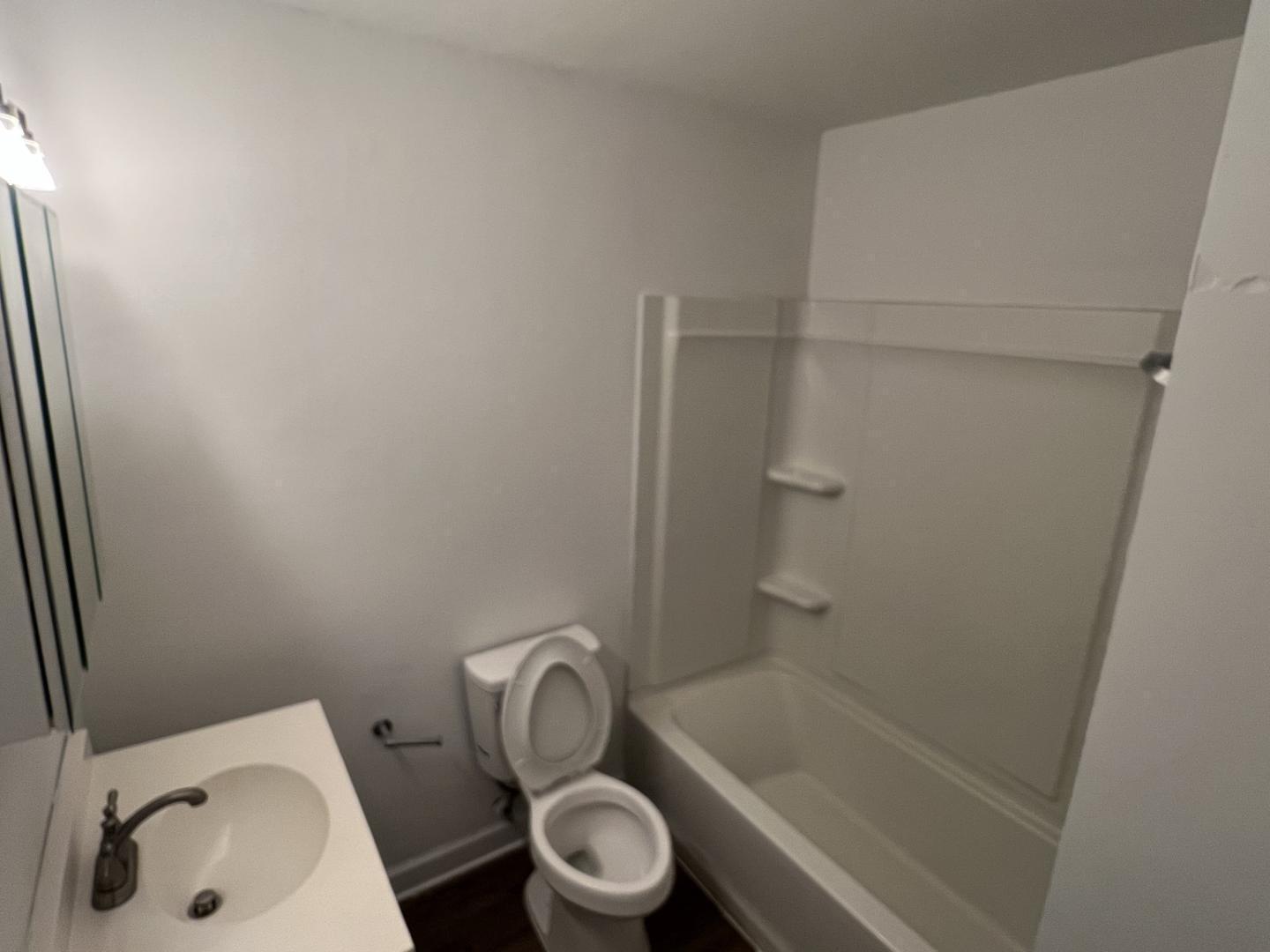 222 Weston Road Garner, NC 27529 - Photo 16 of 27 a bathroom with a sink and a toilet