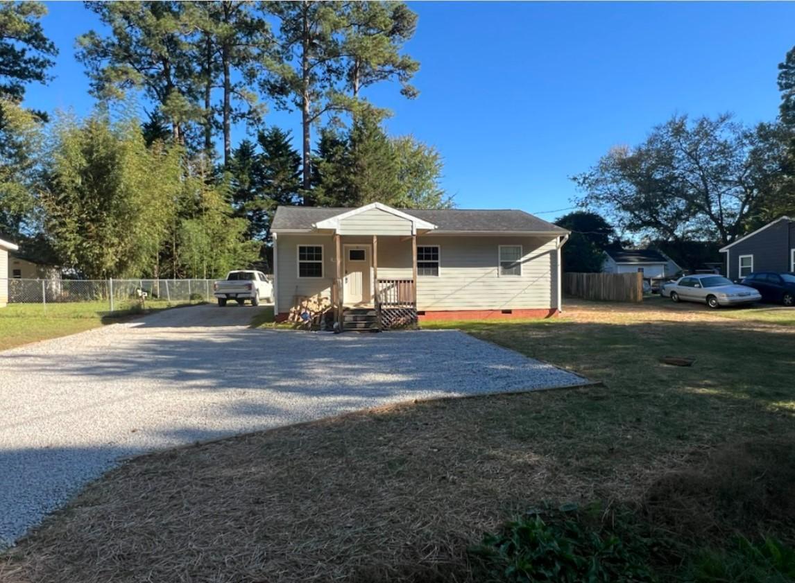 222 Weston Road Garner, NC 27529 - Photo 20 of 27 a front view of a house with a yard