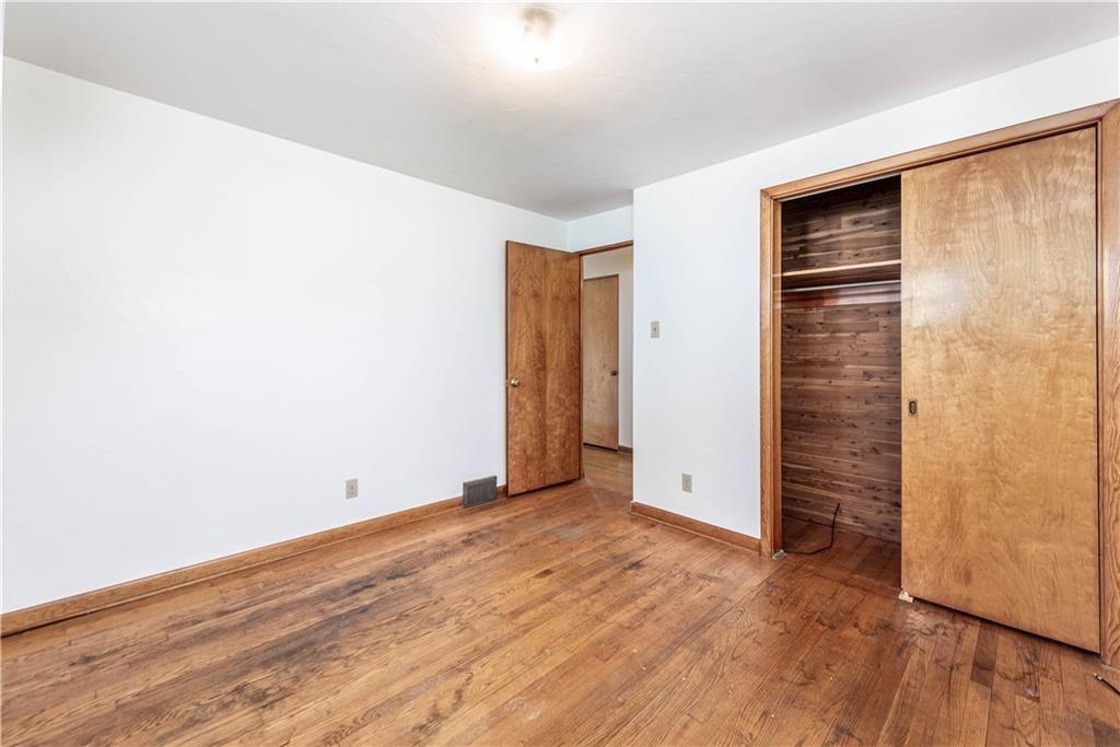 6576 Library Road South Park, PA 15129 - Photo 18 of 31 a view of an empty room with wooden floor and closet