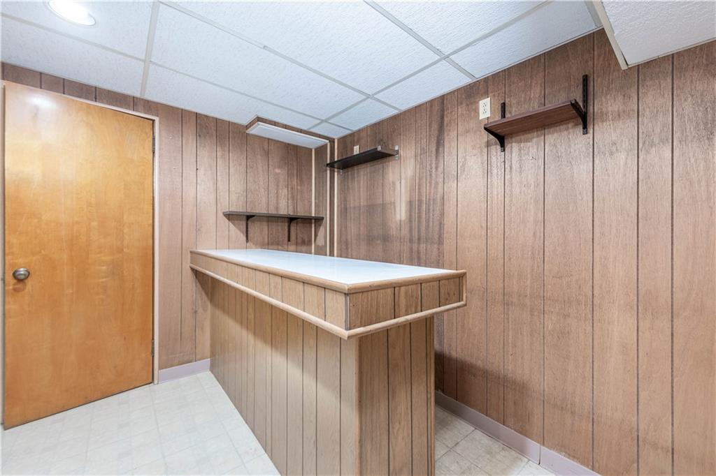 6576 Library Road South Park, PA 15129 - Photo 20 of 31 a kitchen with kitchen island a sink cabinets and stainless steel appliances