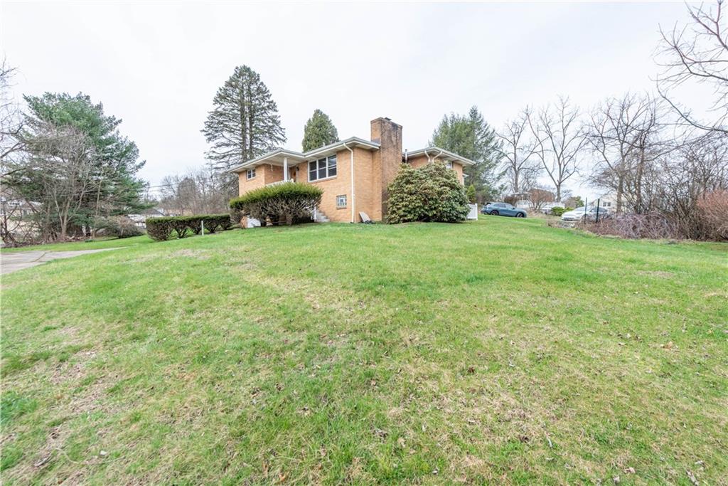 6576 Library Road South Park, PA 15129 - Photo 2 of 31 a front view of a house with garden