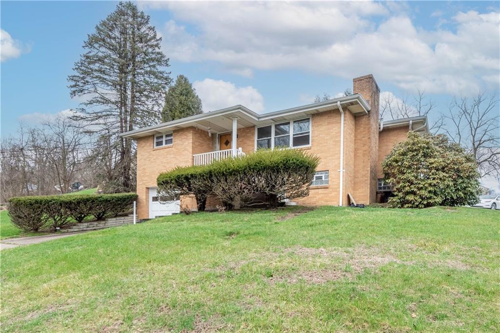 6576 Library Road South Park, PA 15129 - Photo 3 of 31 a view of a house with a yard and plants