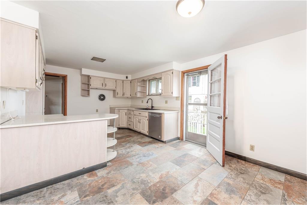 6576 Library Road South Park, PA 15129 - Photo 7 of 31 a kitchen with white cabinets and white appliances