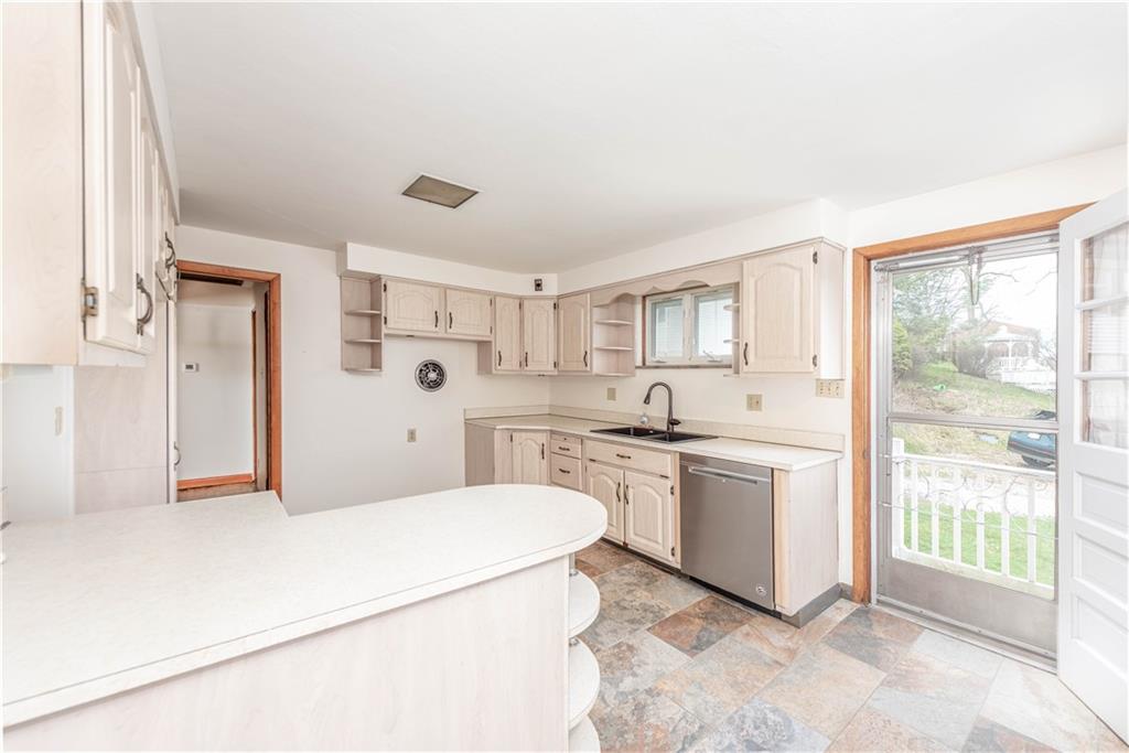 6576 Library Road South Park, PA 15129 - Photo 8 of 31 a kitchen with a sink stove and refrigerator