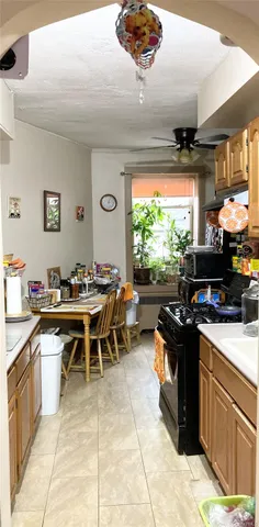 a kitchen with a sink dining table and chairs