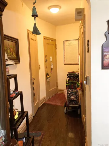 a view of walk in closet with furniture and a window