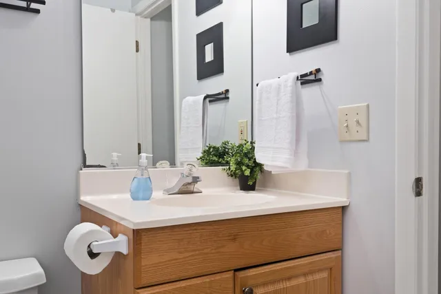 a bathroom with a sink and mirror