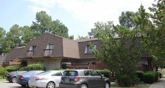 a view of a car parked in front of a house