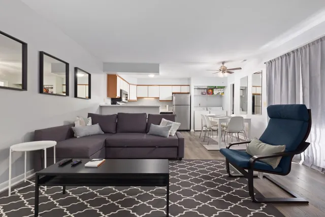 a living room with furniture and a rug