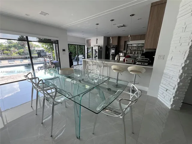 a view of a dining room with furniture window and outside view