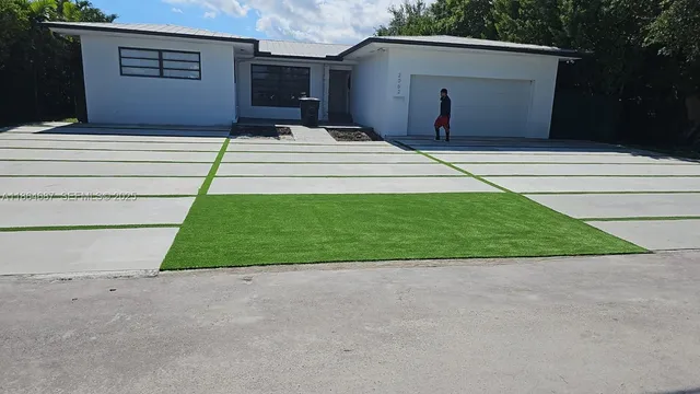 a backyard of a house with garage and garage