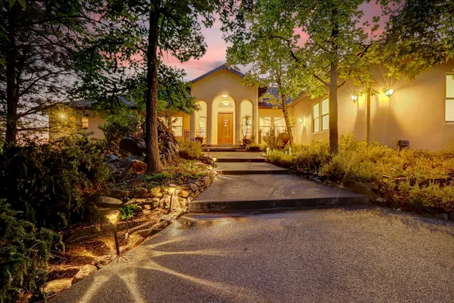 a view of a house with a yard and garage