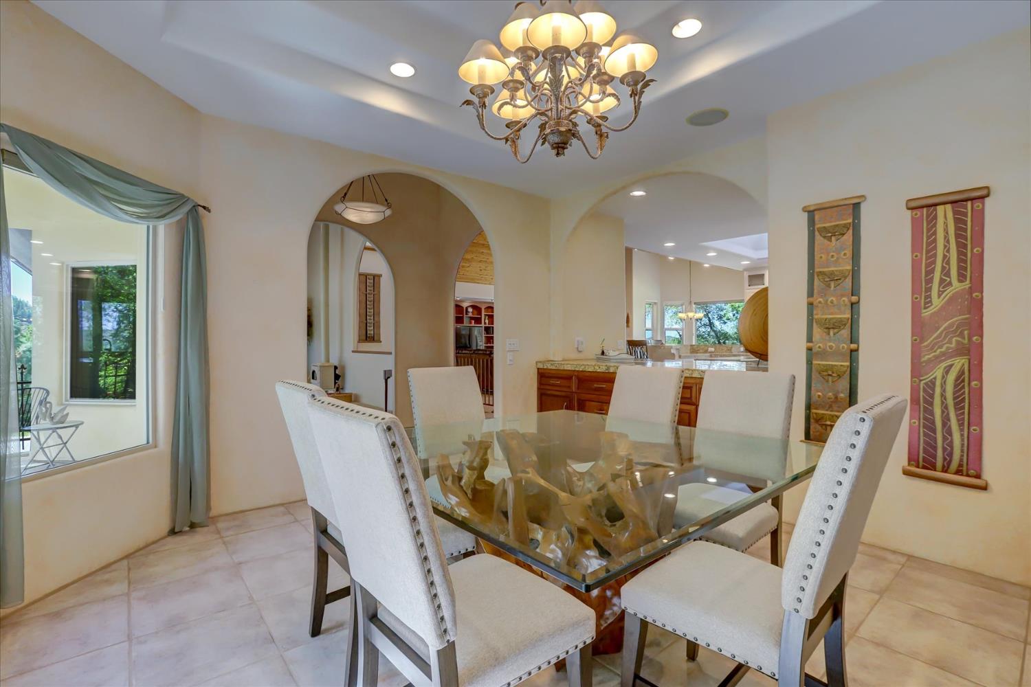 16875 Southridge Road Penn Valley, CA 95946 - Photo 11 of 89 a view of a dining room with furniture a chandelier and wooden floor