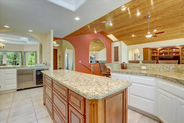 a stove top oven sitting inside of a kitchen