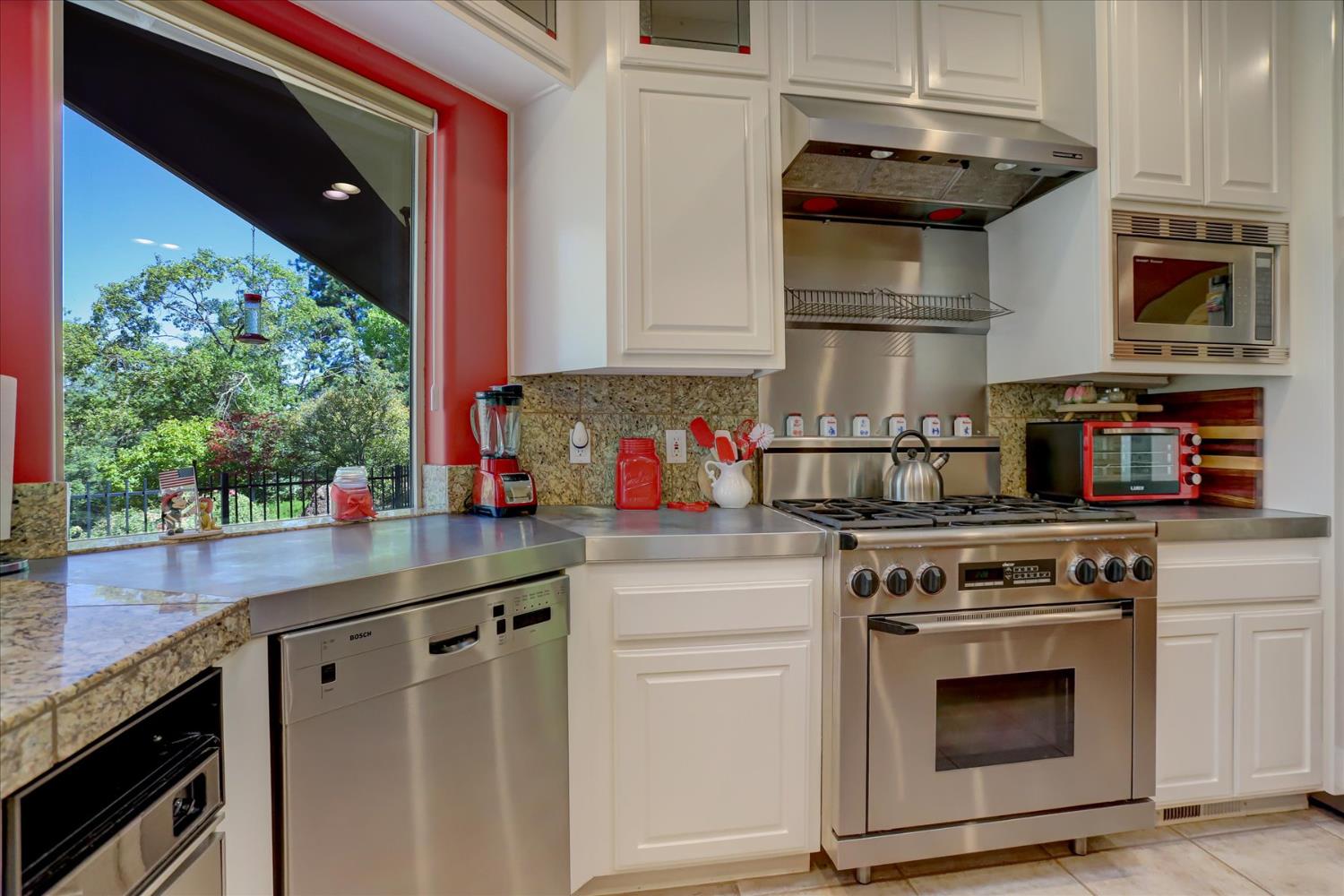 16875 Southridge Road Penn Valley, CA 95946 - Photo 18 of 89 a kitchen with stainless steel appliances granite countertop a stove and a microwave