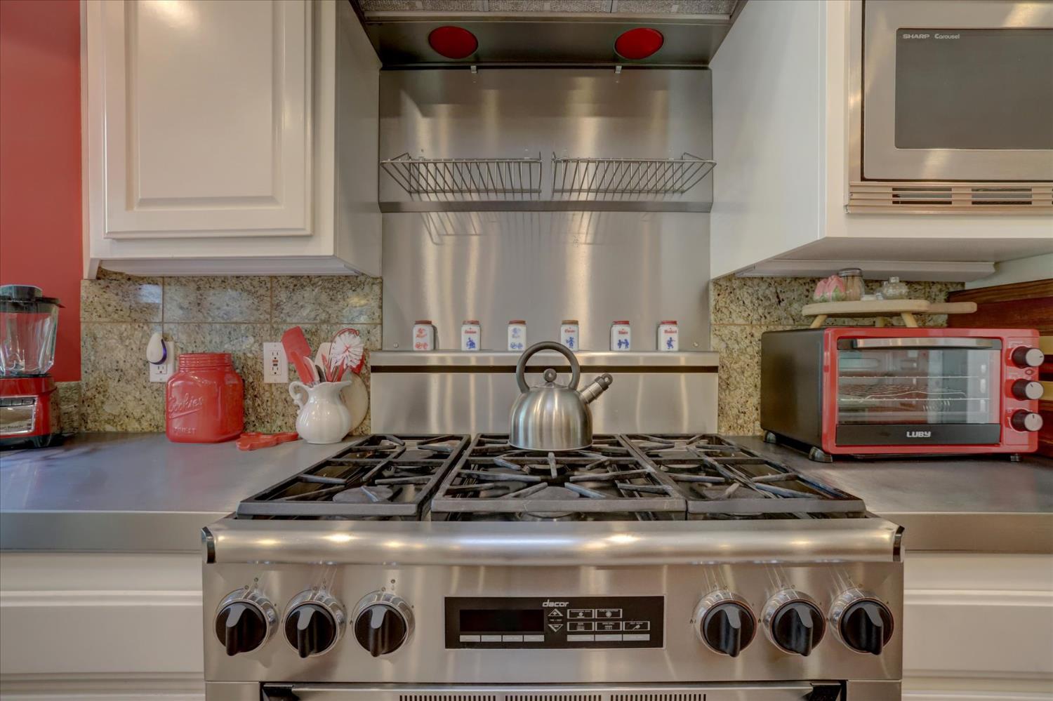 16875 Southridge Road Penn Valley, CA 95946 - Photo 21 of 89 a stove top oven sitting inside of a kitchen