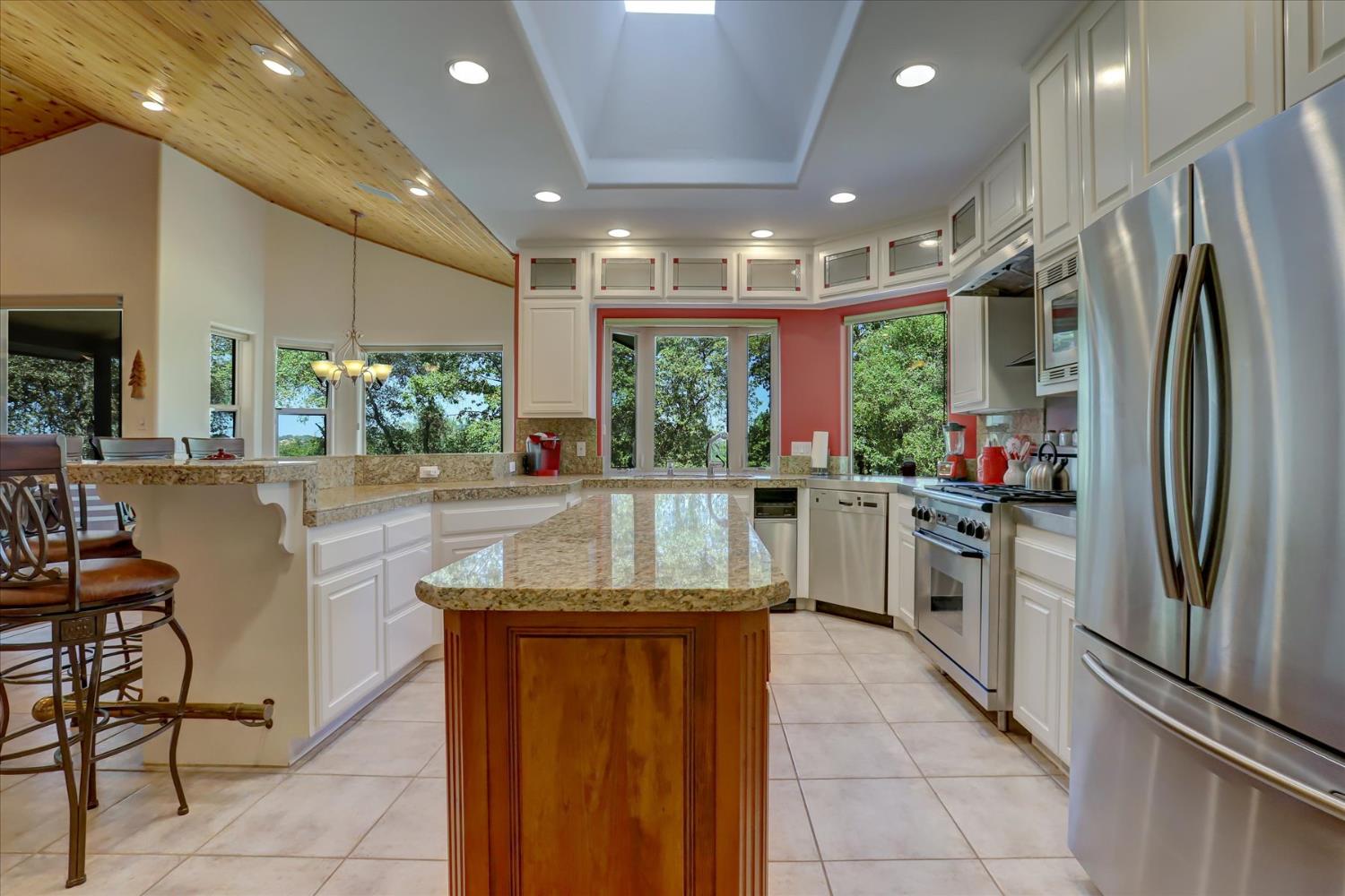 16875 Southridge Road Penn Valley, CA 95946 - Photo 23 of 89 a kitchen with stainless steel appliances granite countertop a refrigerator and a sink