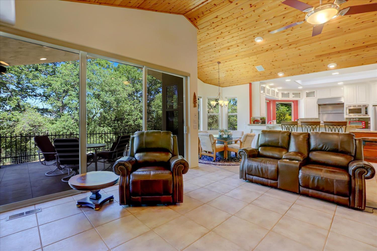 16875 Southridge Road Penn Valley, CA 95946 - Photo 27 of 89 a living room with furniture and a floor to ceiling window