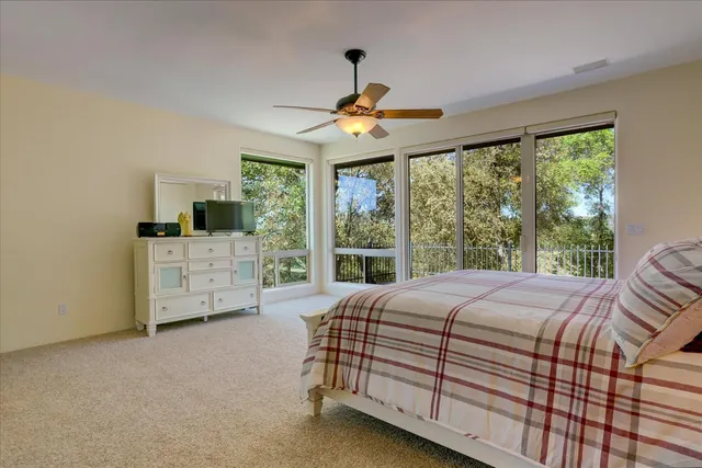 a bedroom with furniture and a window
