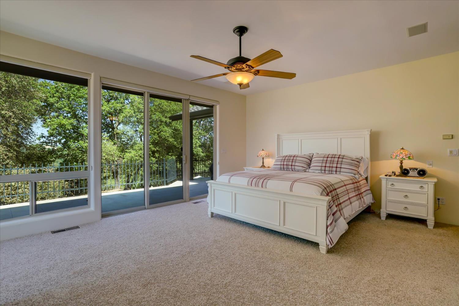 16875 Southridge Road Penn Valley, CA 95946 - Photo 30 of 89 a spacious bedroom with a bed and a large window