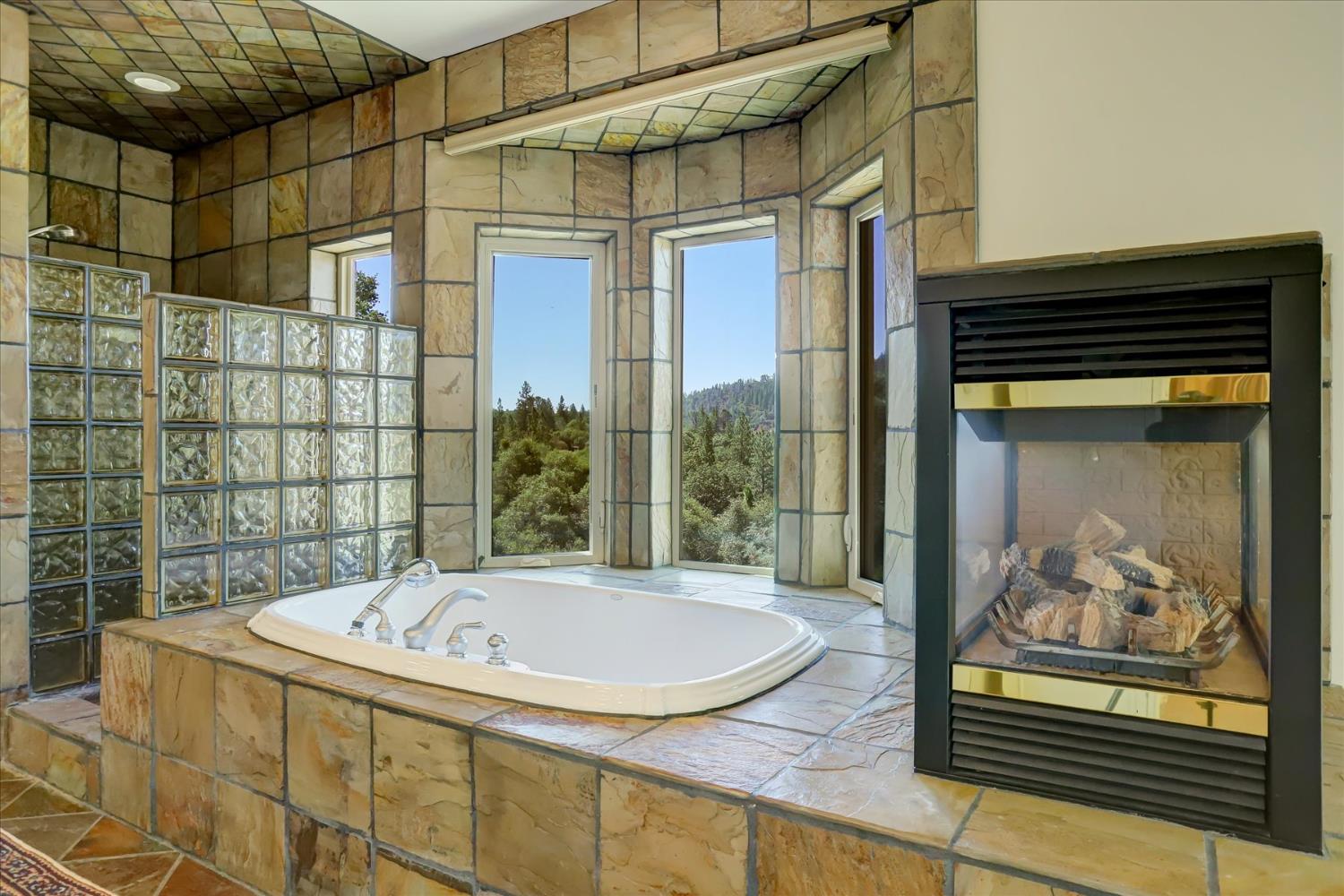 16875 Southridge Road Penn Valley, CA 95946 - Photo 31 of 89 a bathroom with a tub and shower
