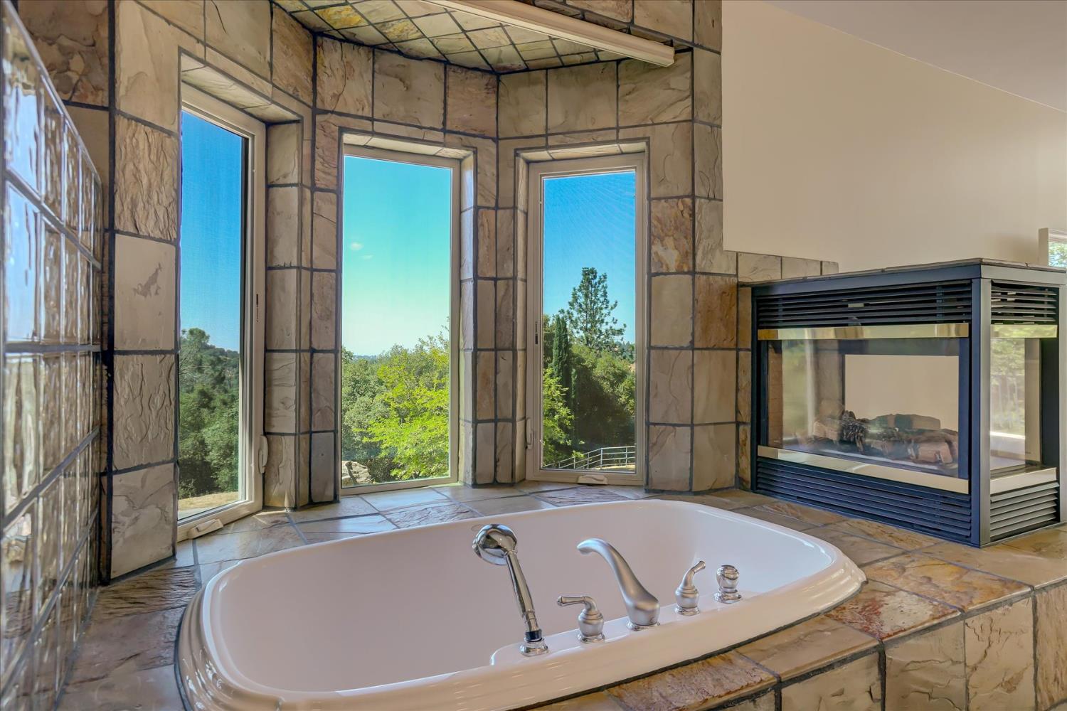 16875 Southridge Road Penn Valley, CA 95946 - Photo 32 of 89 a bathroom with a tub and shower