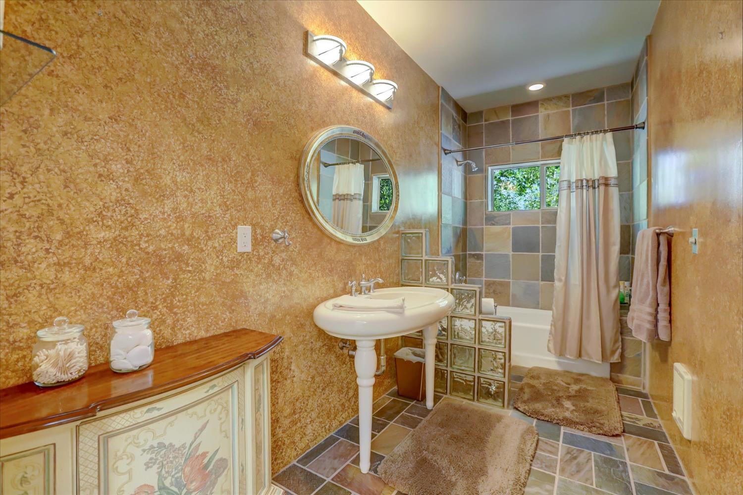 16875 Southridge Road Penn Valley, CA 95946 - Photo 37 of 89 a bathroom with a sink and a mirror