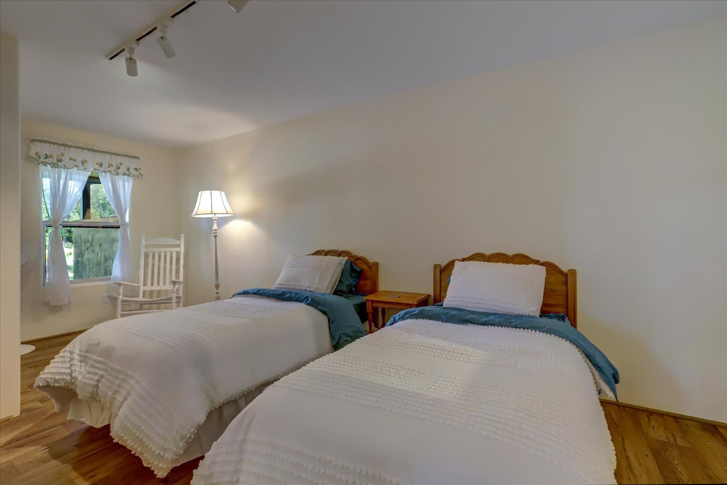 16875 Southridge Road Penn Valley, CA 95946 - Photo 44 of 89 a bedroom with two beds and a window