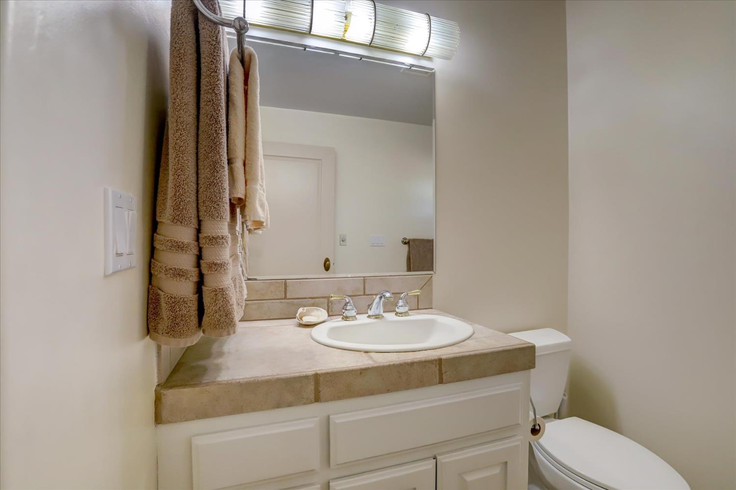 16875 Southridge Road Penn Valley, CA 95946 - Photo 46 of 89 a bathroom with a sink and a mirror