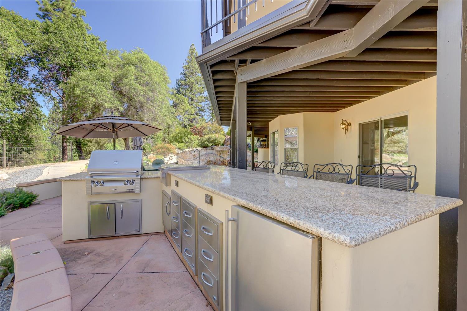 16875 Southridge Road Penn Valley, CA 95946 - Photo 58 of 89 a kitchen with a stove and a sink