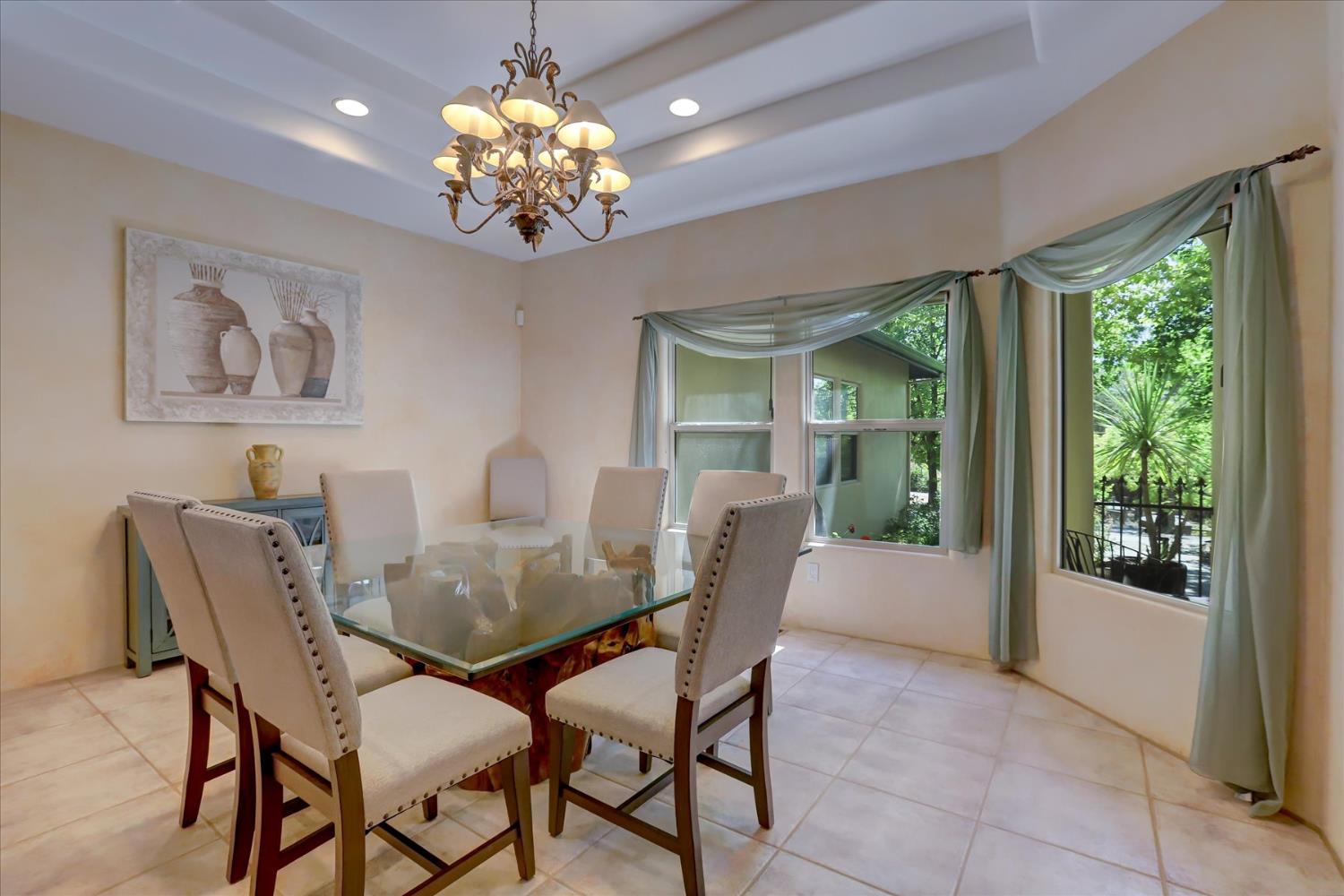 16875 Southridge Road Penn Valley, CA 95946 - Photo 10 of 89 a view of a dining room with furniture a chandelier and window