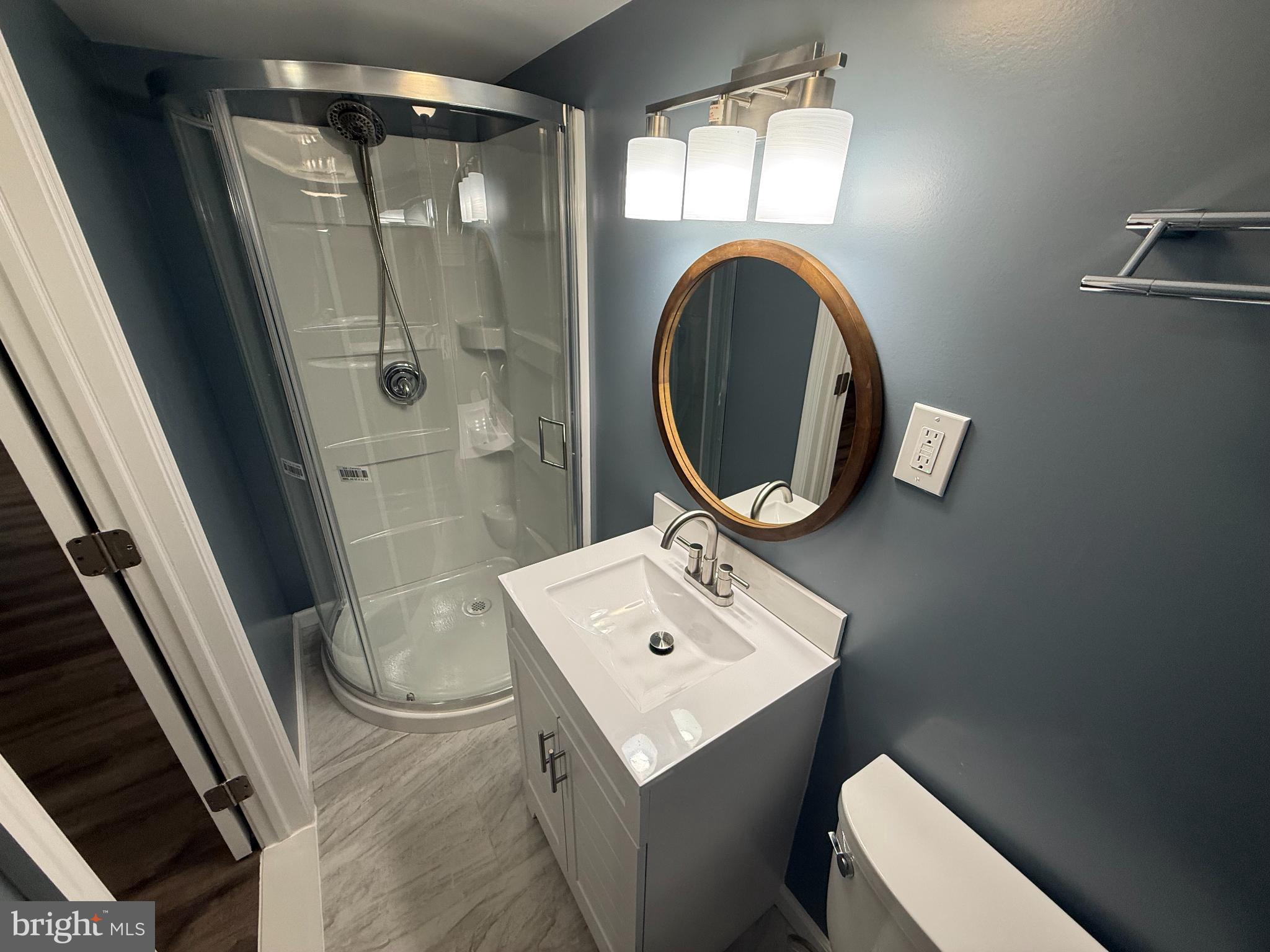 4433 Old Frederick Road Baltimore, MD 21229 - Photo 20 of 37 Modern full bathroom with sleek design elements.