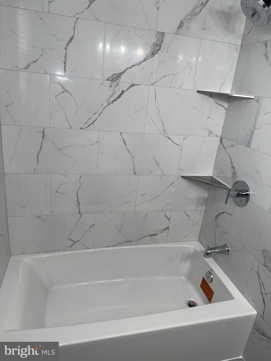 4433 Old Frederick Road Baltimore, MD 21229 - Photo 23 of 37 Sleek marble bath retreat with modern fixtures.