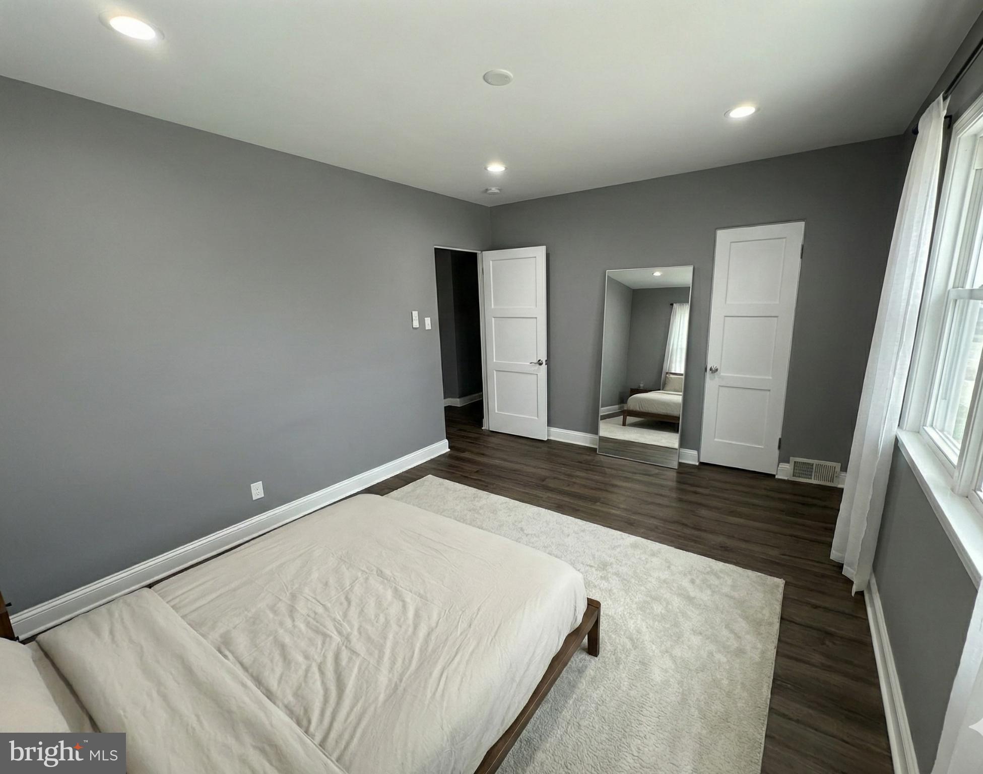 4433 Old Frederick Road Baltimore, MD 21229 - Photo 26 of 37 Modern bedroom (1 with serene gray tones. (Staged)