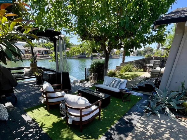 a white stove top oven sitting inside of a kitchen