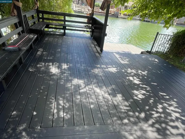 a view of a wooden deck with a bench