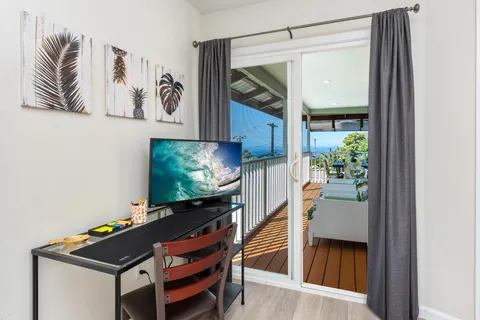 a room with furniture and flat screen tv