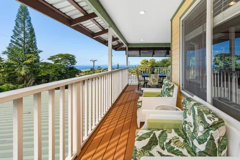 a view of balcony with furniture