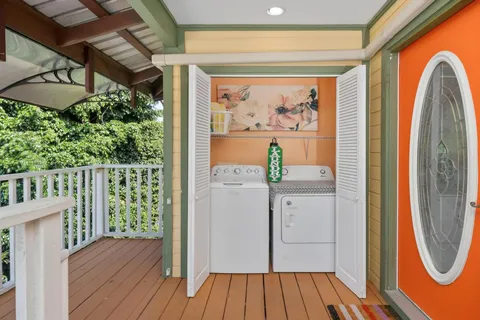 a view of a room with wooden floor and entrance
