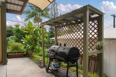 a view of a hallway view with wooden floor and closet