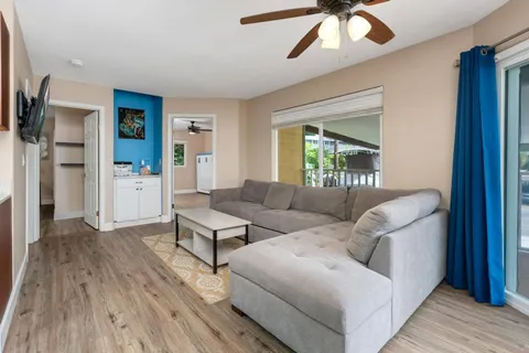 a bedroom with a bed and a television