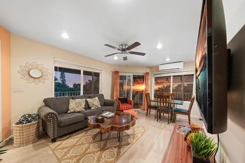 a view of balcony with wooden floor and outdoor seating