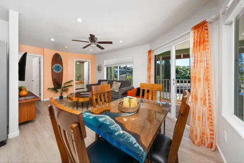 a view of a dining room with furniture window and outside view