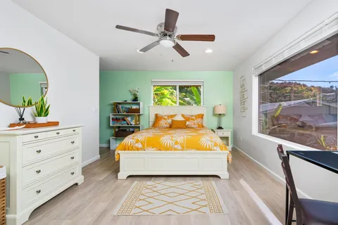 a bed room with a bed and a window