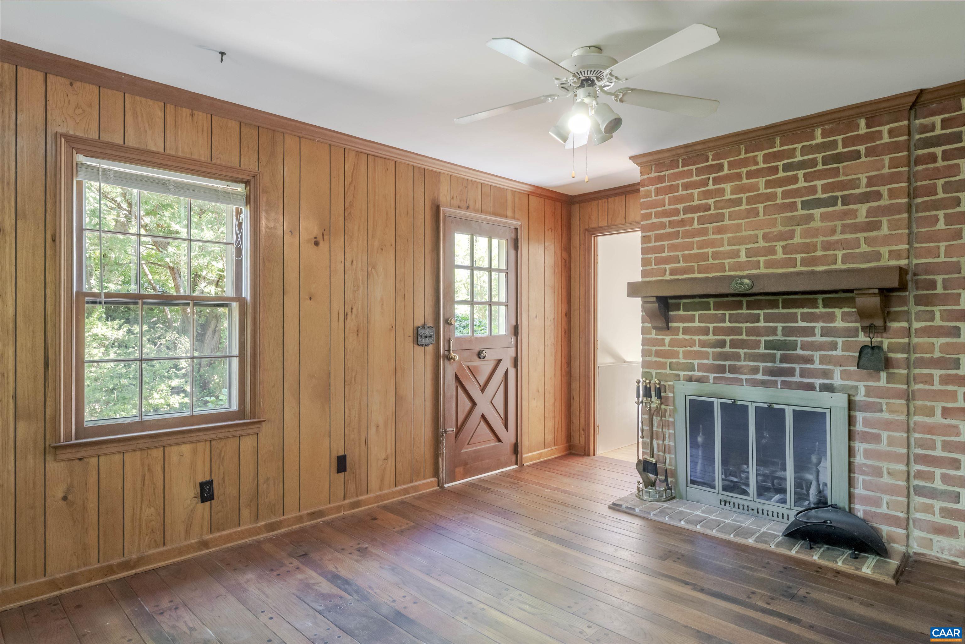 207 Surrey Road Charlottesville, VA 22901 - Photo 10 of 38 A sweet spot to wait for dinner. Connected to the livingroom, kitchen and outdoor patio. Has a skylight and a wood burning fireplace.