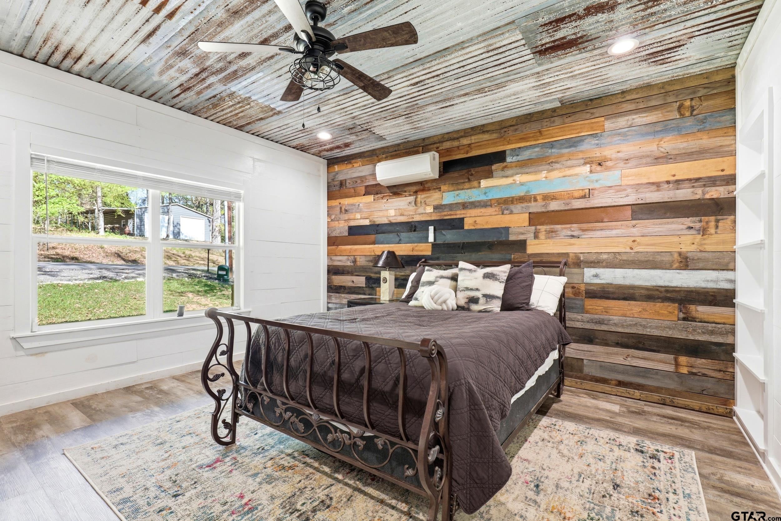 132 King George Road Scroggins, TX 75480 - Photo 14 of 35 a bedroom with furniture and a window