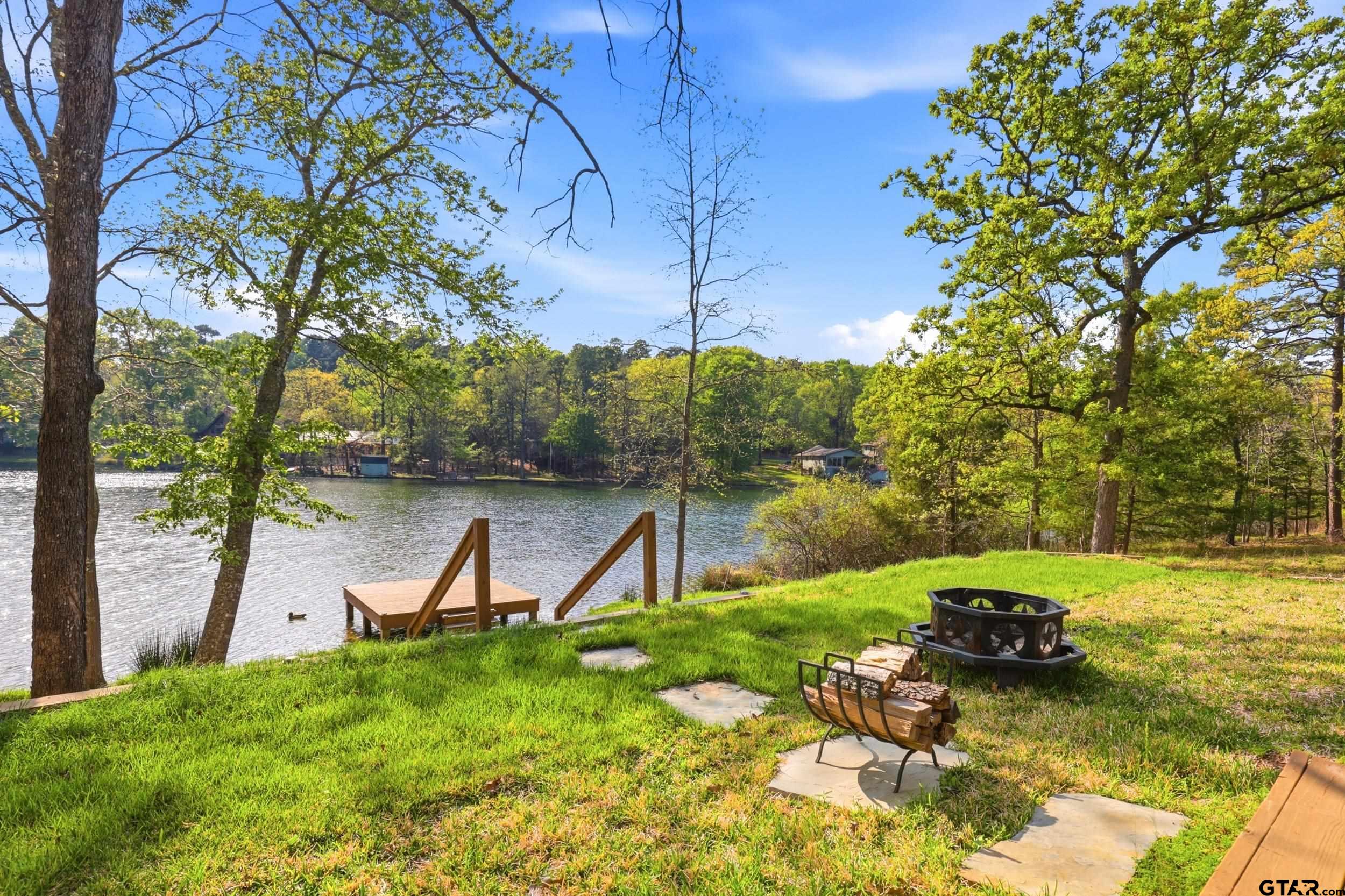 132 King George Road Scroggins, TX 75480 - Photo 21 of 35 a view of a lake with a yard