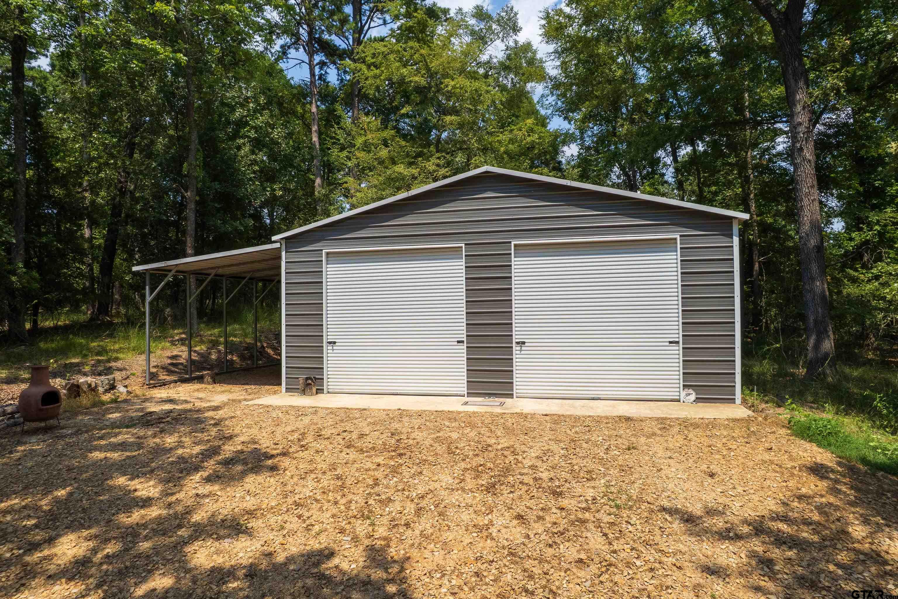 132 King George Road Scroggins, TX 75480 - Photo 27 of 35 a front view of a house with a yard