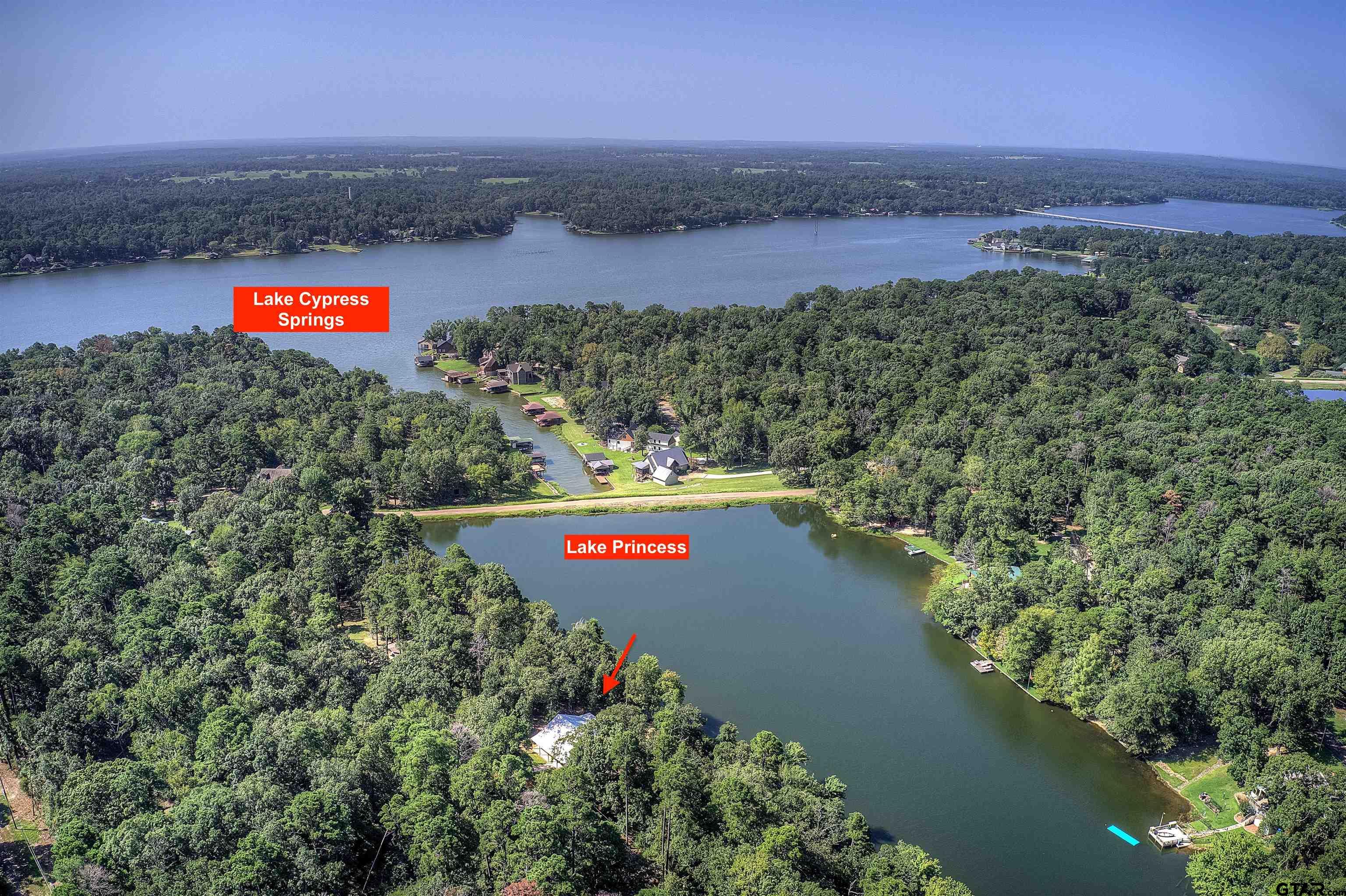 132 King George Road Scroggins, TX 75480 - Photo 30 of 35 a view of a lake with a yard and mountain in the back